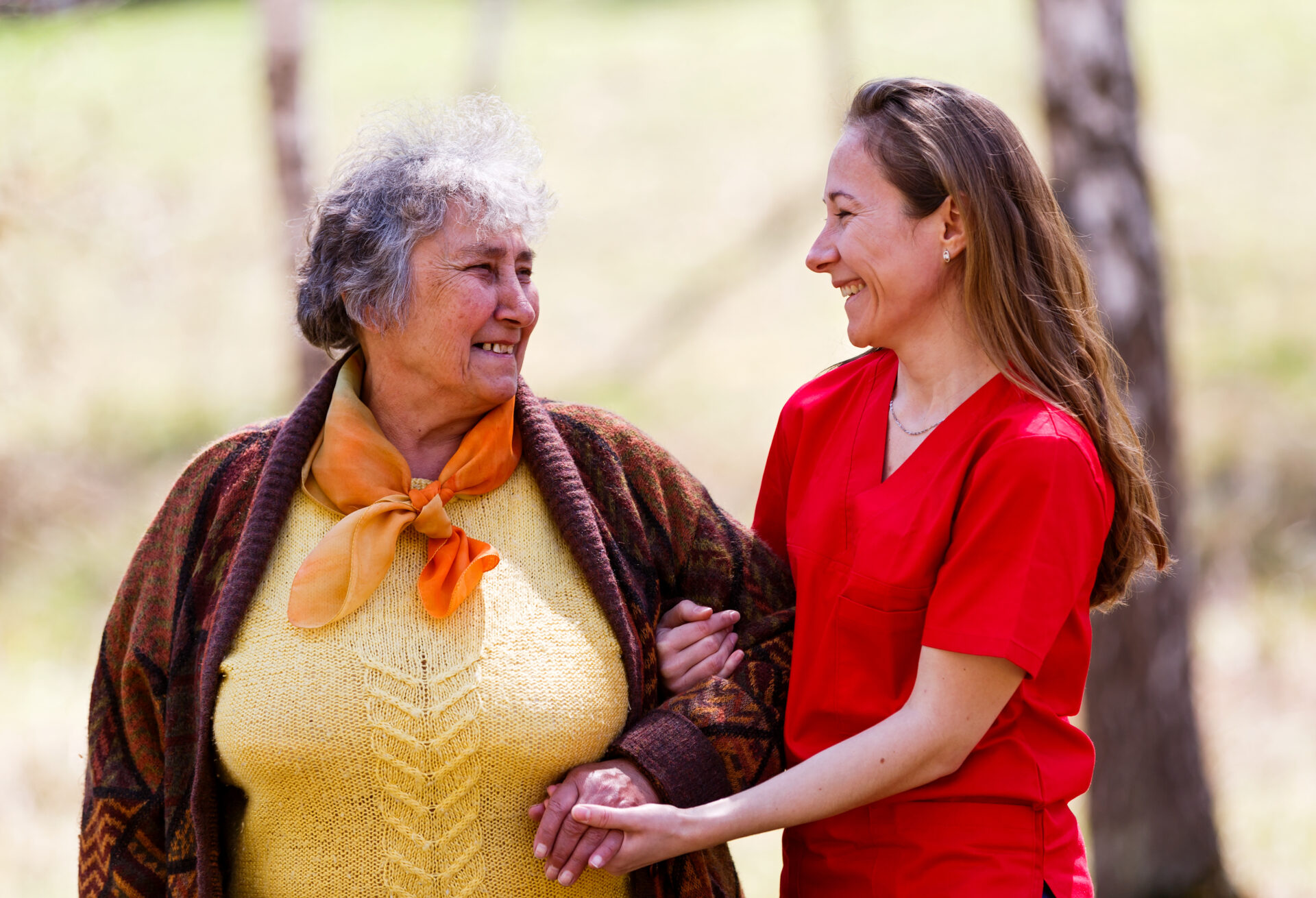 Elderly woman and young caregiver Elderly woman and young caregiver